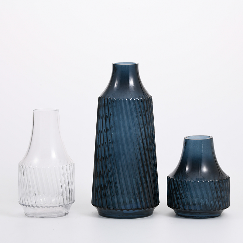 Hot sale heavy duty modern style dark blue bottle design with floral luxury glass flower vase Chinese manufacture