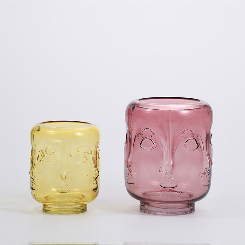 Heavy duty high fashion human face with Heart shape design artistic glass flower vase Chinese manufacture