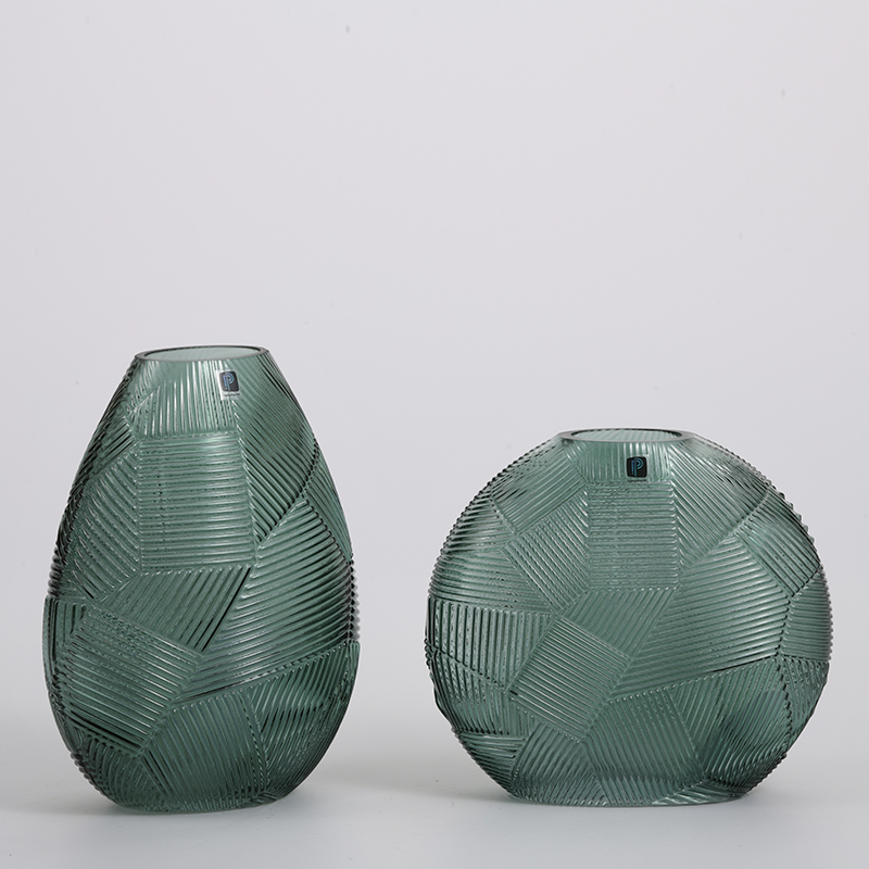Pattern of grass green and plant leaf shape in home glass vase