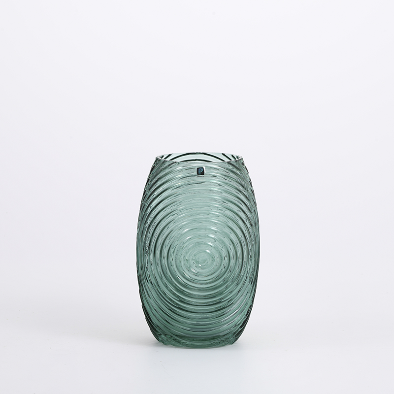 Pattern of grass green and plant leaf shape in home glass vase