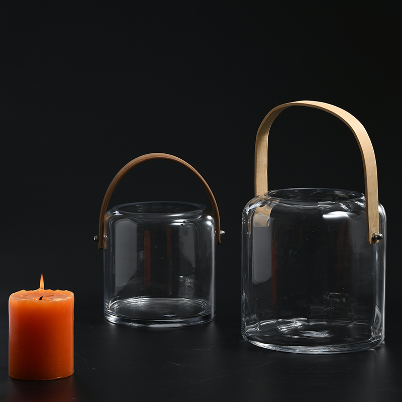 Glassware factory directly transparent glassware for home decoration flower container with handle glass flower vase