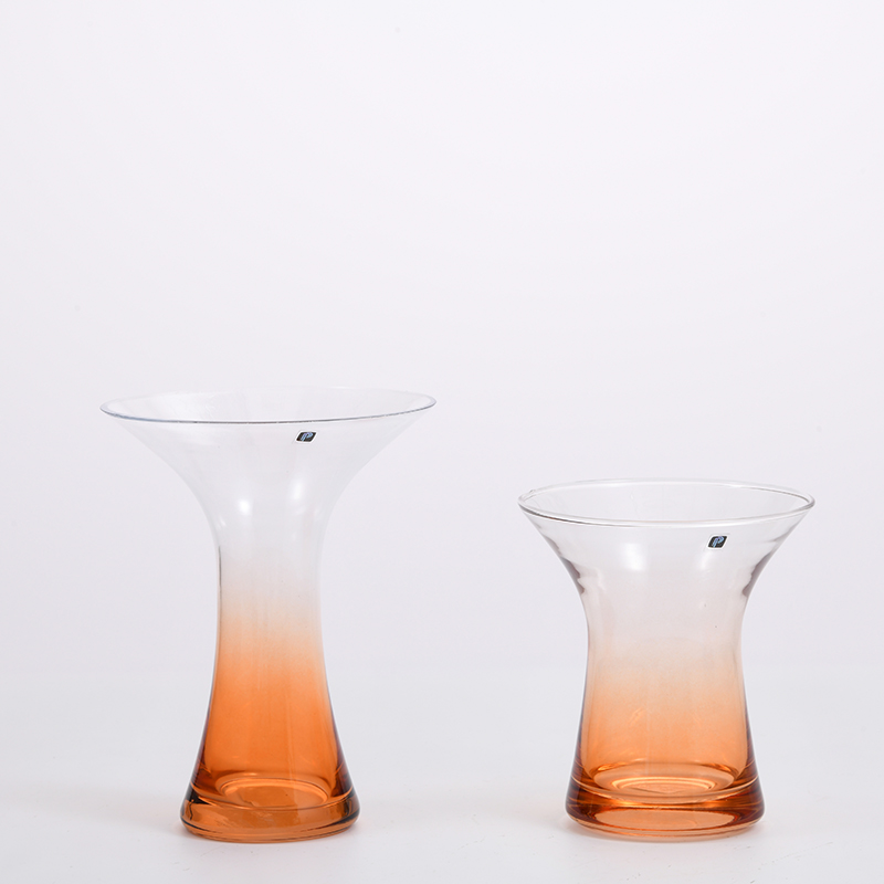 Transparent gradient colored with orange bottom and open mouth glass flower vase for home or office decoration