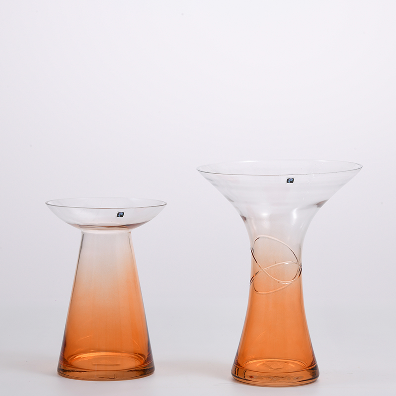 Transparent gradient colored with orange bottom and open mouth glass flower vase for home or office decoration